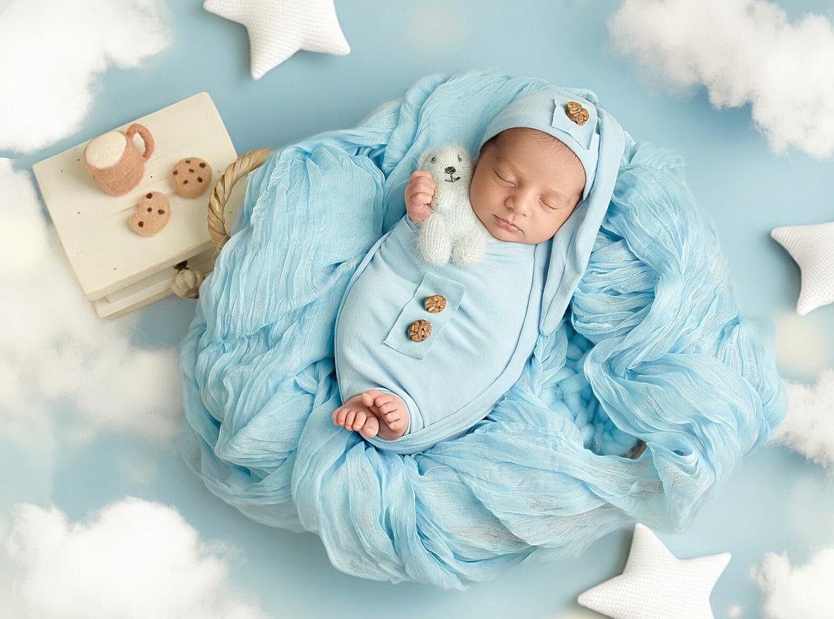 Newborn baby in soft blue setup with props and textures – London newborn photographer