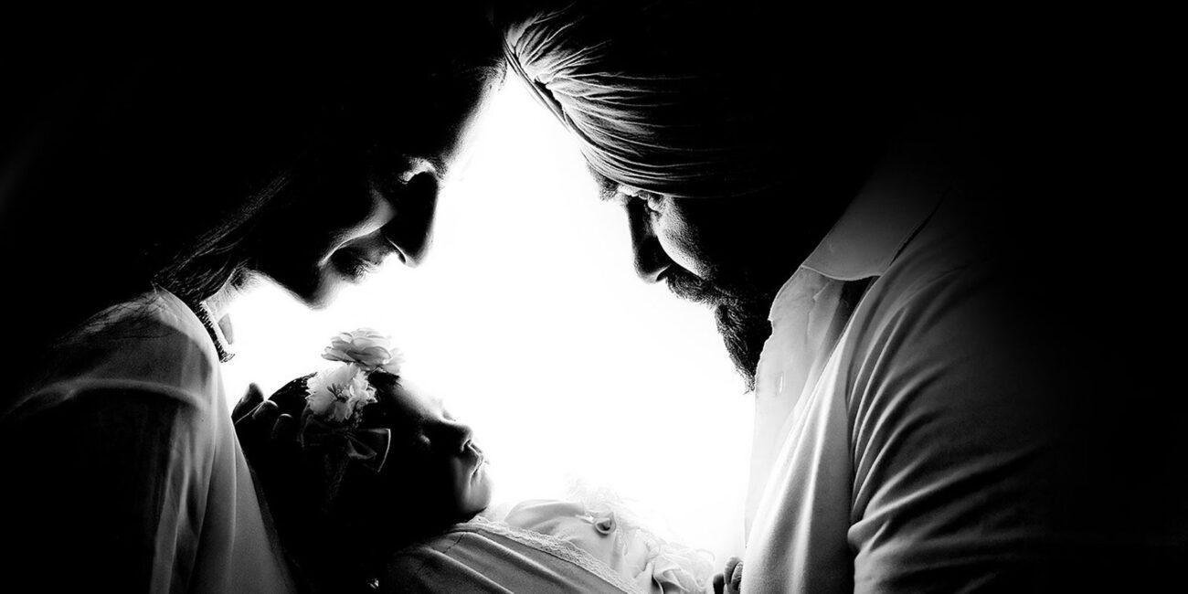 silhouette newborn portrait with parent holding baby – London newborn photographer